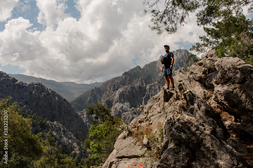 Man standing on the rock on the beautiful landscape