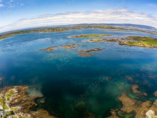 Aerial view of Bay with low tide, seaweeds and mountains in Carraroe