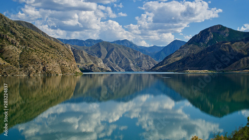 Erzurum, Tortum lake, cliff mountains and cloud reflection in water