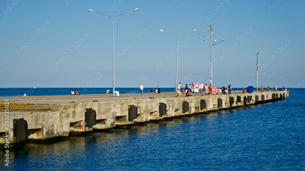 Sinop harbor, pier and strollers