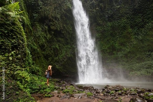 Woman near Nung Nung waterfal on Bali  Indonesia