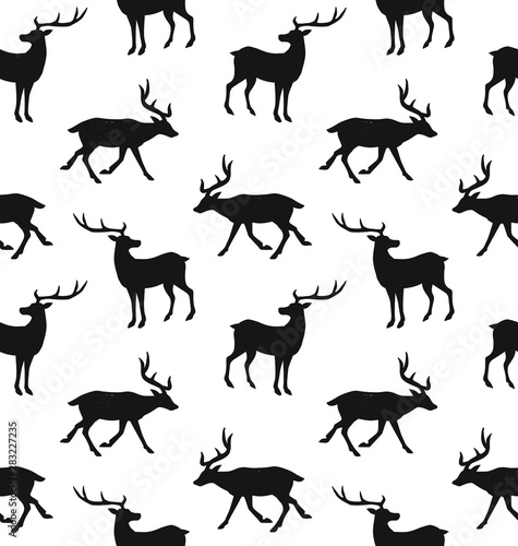 Vector seamless pattern of black deer silhouette isolated on white background © Sweta