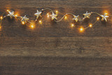 Christmas wooden background with festive decorative garland