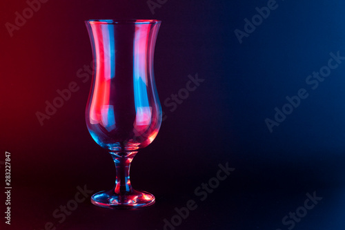 Smoothie Glass on a black background with a red and blue light