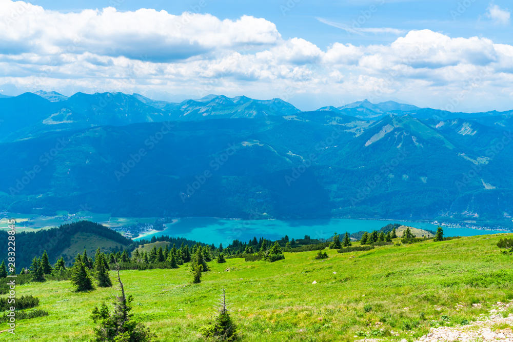 View of landscape with St. Wolfgang lake and mountains from Schafberg mountain, Austria
