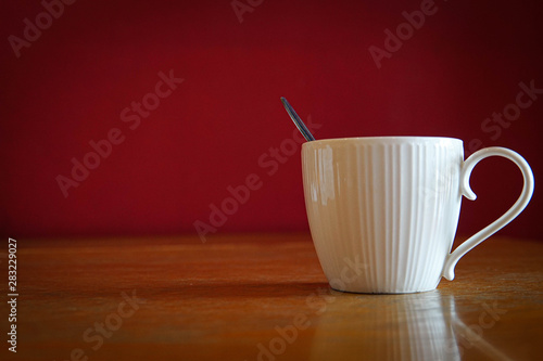 cup of coffee on wooden table