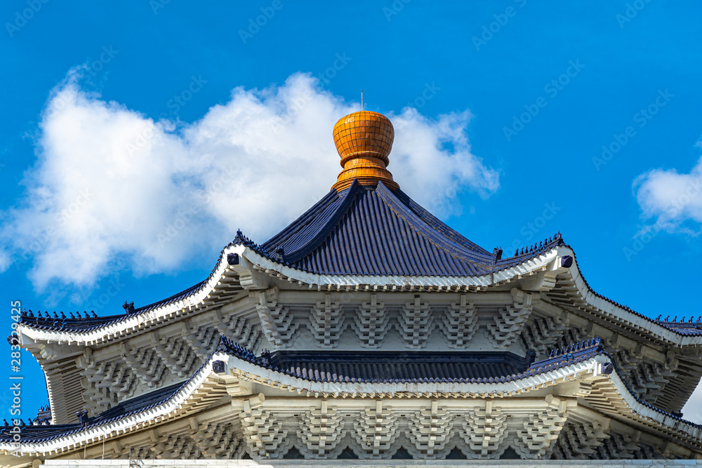 The roof of The National Taiwan Democracy Memorial Hall main building with clear blue sky background. Taipei, Taiwan. The roof of The National Taiwan Democracy Memorial Hall main building with clear blue sky background. Taipei, Taiwan.