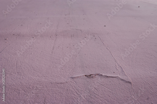 Cement wall with roughness  cracks and bumps. Abstract grunge background.