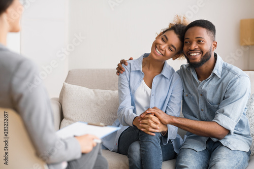 Afro Spouses Hugging Happily After Reconciling On Marital Counseling