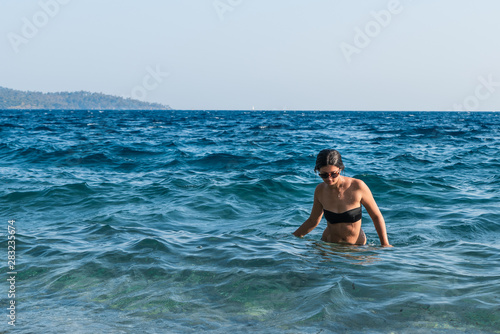 Young beautiful girl in the sea