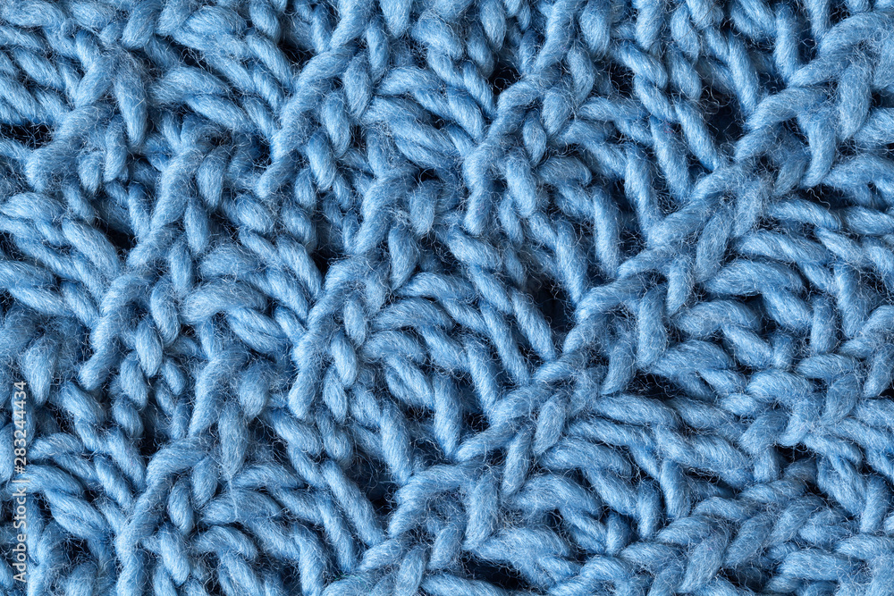 Knitted woolen textured surface, macro. Soft grey blue merino wool pattern backdrop, closeup. Autumn and winter flat lay. Scandinavian minimal style Knitted woolen textured surface, macro. Soft grey blue merino wool pattern backdrop, closeup. Autumn and winter flat lay. Scandinavian minimal style