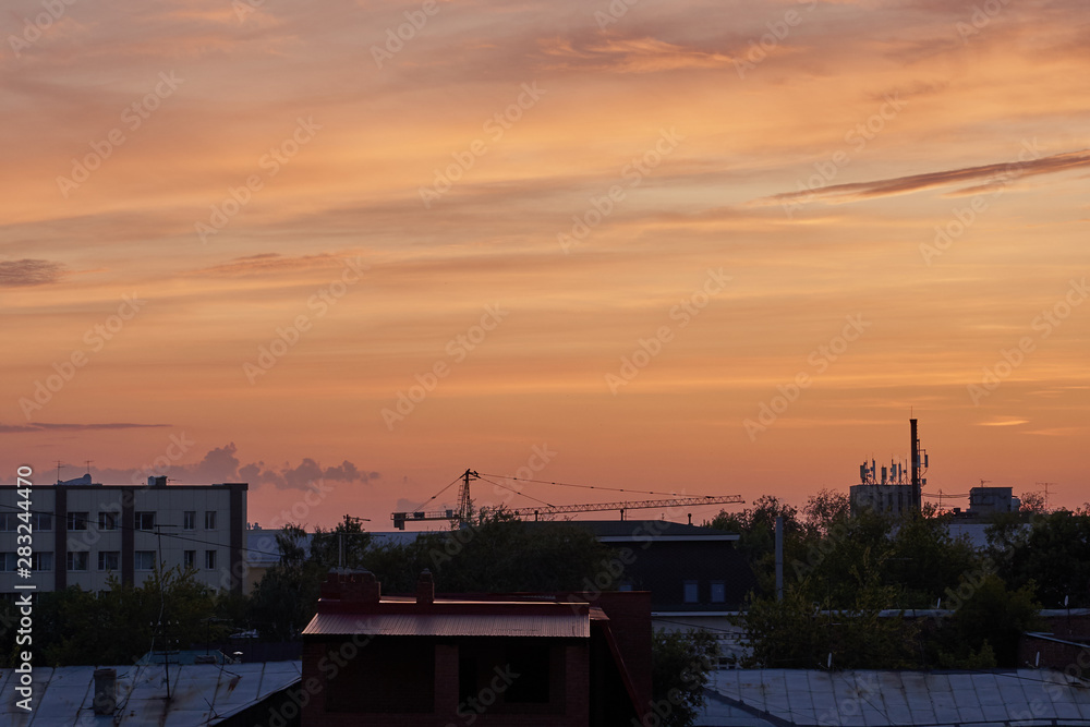 Beautiful sunset over a provincial town, city at dusk