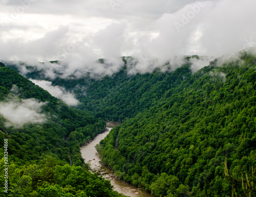 Mountain River with Low Clouds