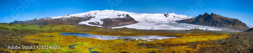 Panoramic View of Fjallsarlon Glacier Lagoon and colour moss at foreground