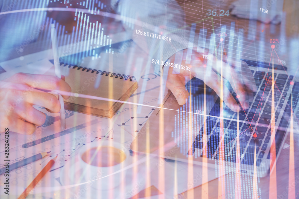 Forex graph with businessman working on computer in office on background. Concept of hardworking. Double exposure. Forex graph with businessman working on computer in office on background. Concept of hardworking. Double exposure.