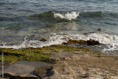 rocky coast of the Mediterranean sea. Wind, waves, deserted beach. A holiday in the South