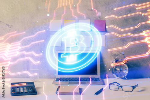 Double exposure of blockchain and crypto economy theme hologram and table with computer background. Concept of bitcoin cryptocurrency.