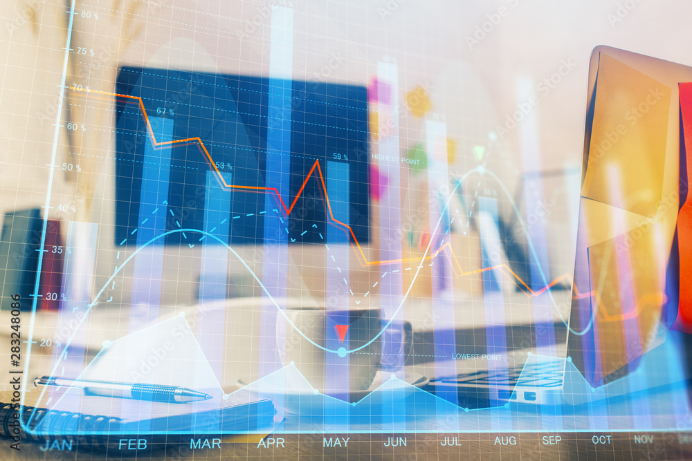 Financial graph colorful drawing and table with computer on background. Double exposure. Concept of international markets. Financial graph colorful drawing and table with computer on background. Double exposure. Concept of international markets.