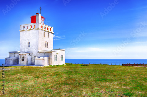 Landscape with white lighthouse at Cape Dyrholaey © pilat666