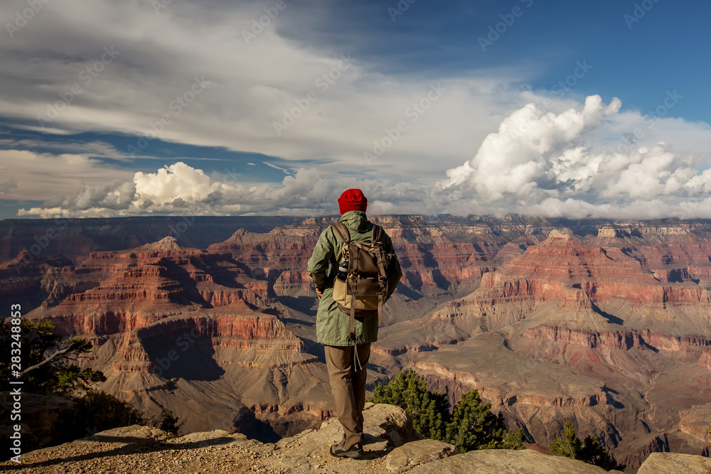Fototapeta premium A hiker in the Grand Canyon National Park, South Rim, Arizona, USA.
