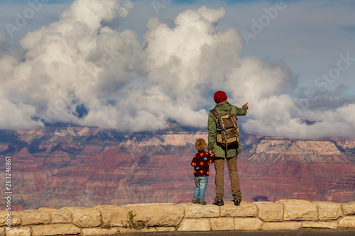A man with his son are hiking in Grand canyon National Park