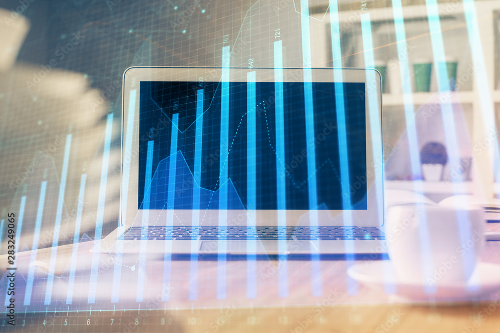 Stock market graph and table with computer background. Double exposure. Concept of financial analysis. Stock market graph and table with computer background. Double exposure. Concept of financial analysis.
