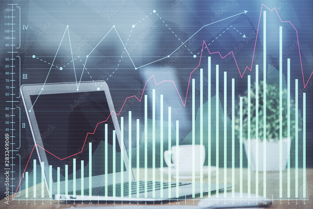 Naklejka premium Financial graph colorful drawing and table with computer on background. Double exposure. Concept of international markets.