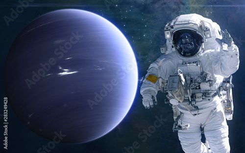 Fototapeta Naklejka Na Ścianę i Meble -  Neptune and astronaut. Solar system. Science fiction. Elements of this image furnished by NASA