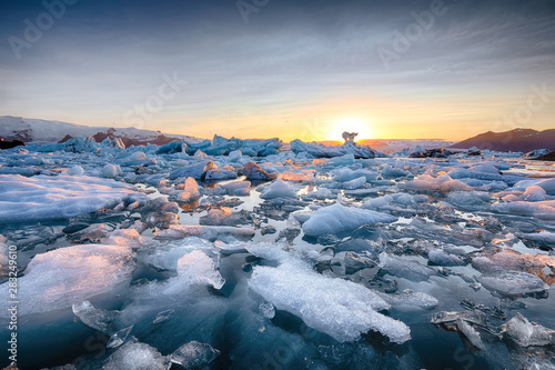 Beautifull landscape with floating icebergs in Jokulsarlon glacier lagoon at sunset