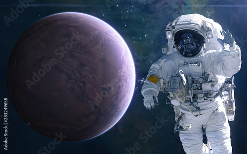 Fototapeta Naklejka Na Ścianę i Meble -  Mars and astronaut. Solar system. Science fiction. Elements of this image furnished by NASA