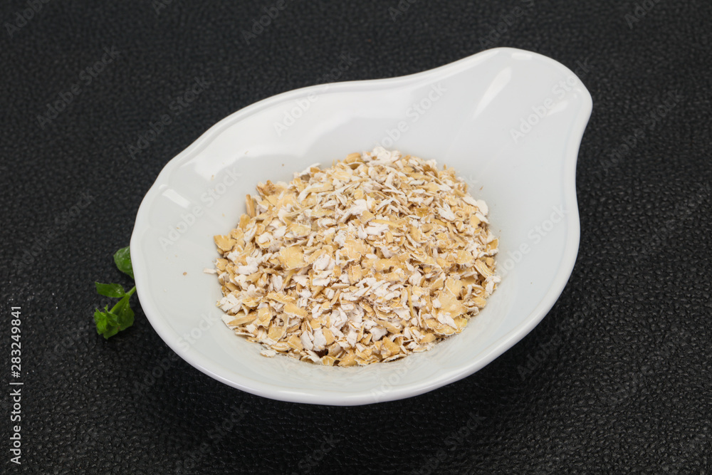Raw oats in the bowl Raw oats in the bowl
