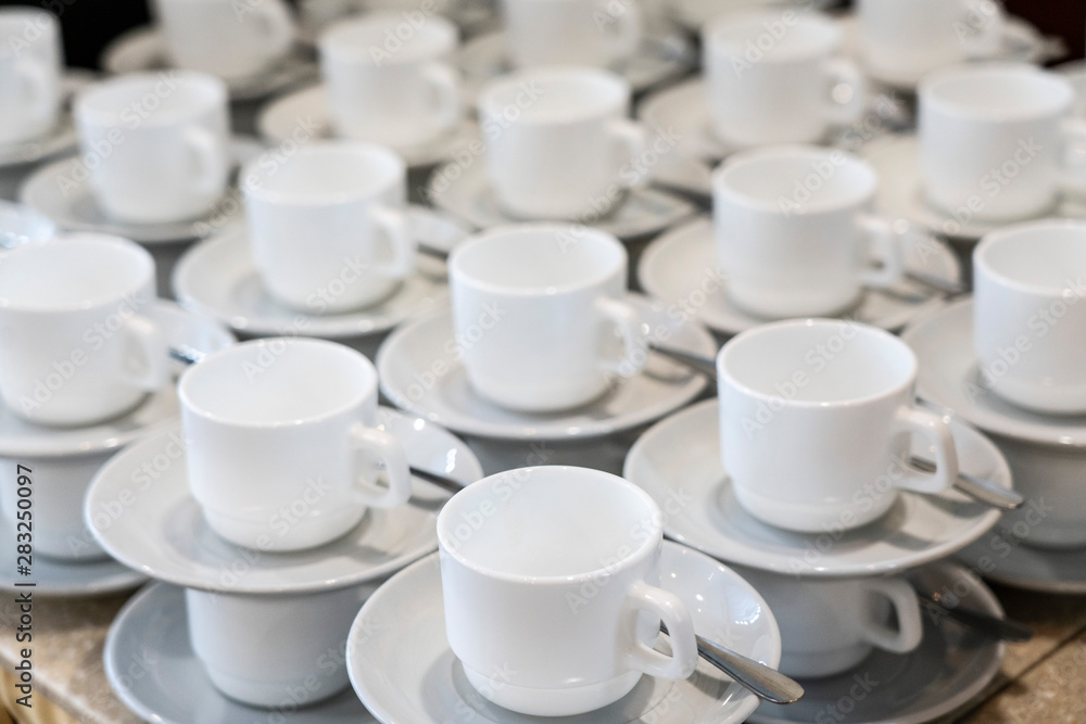 Serving white porcelain coffee and tea cups with saucer Serving white porcelain coffee and tea cups with saucer