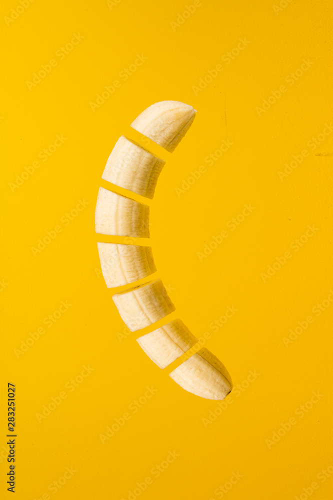 Cut banana on yellow background. Cut banana on yellow background.