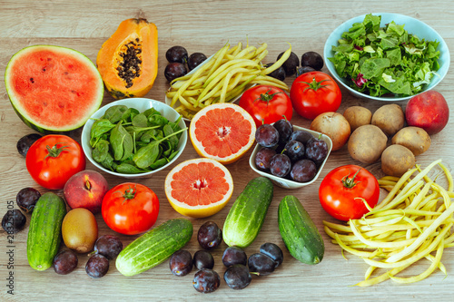 healthy diet  kitchen table full of fruits and vegetables