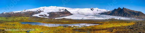 Panoramic View of Fjallsarlon Glacier Lagoon and colour moss at foreground