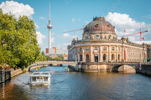 Museum Island, boat on river spree and Tv Tower during summer day in Berlin, Mitte