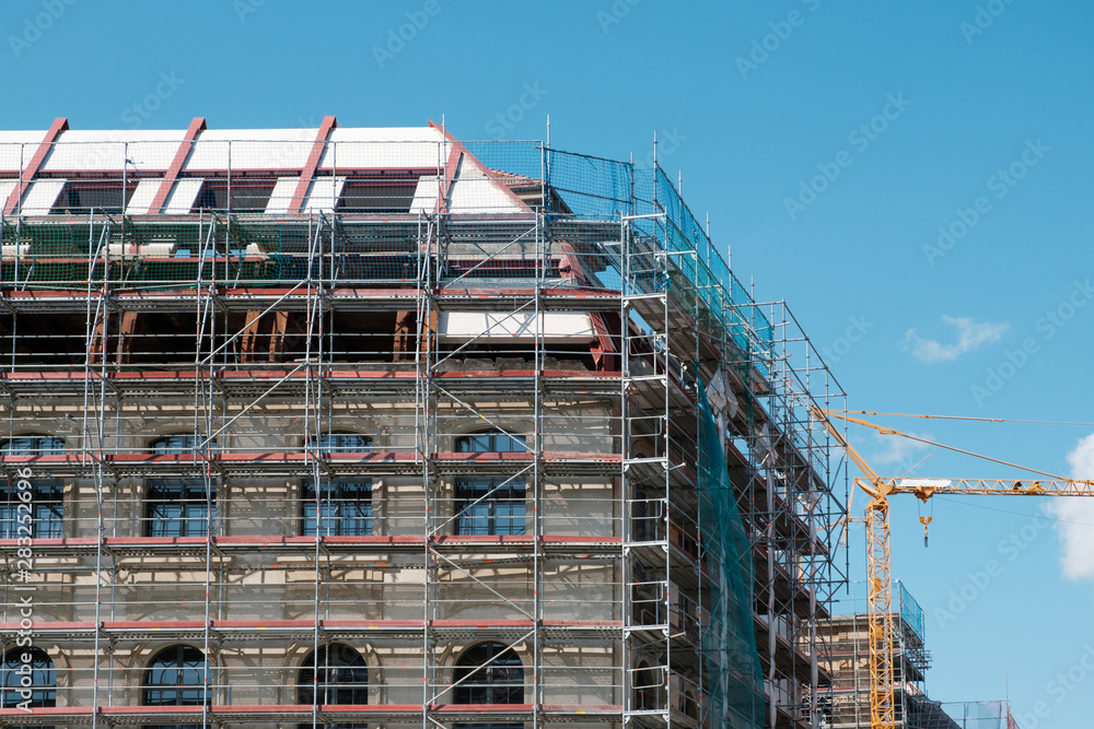 building under construction / restoration - scaffoling on building facade -