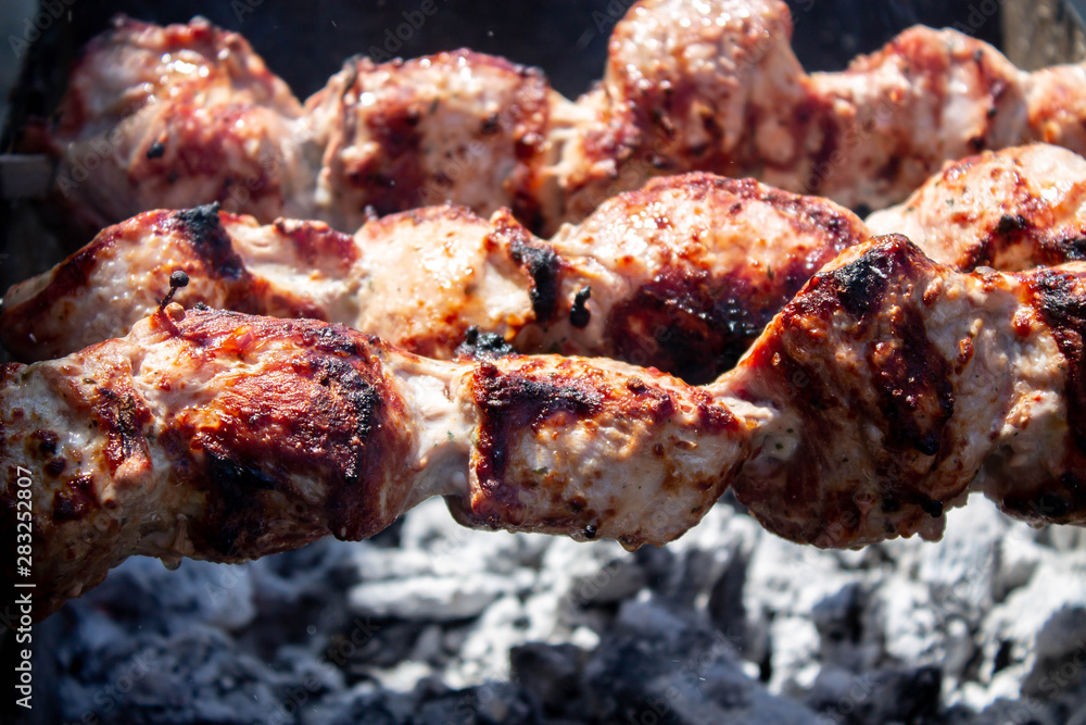 Meat fried on open fire. Barbeque close up Meat fried on open fire. Barbeque close up