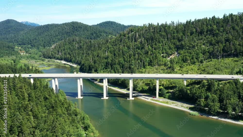 Croatia, Gorski kotar, drone flight over lake Bajer to highway bridge in Fuzine, mountains and forest in background Croatia, Gorski kotar, drone flight over lake Bajer to highway bridge in Fuzine, mountains and forest in background