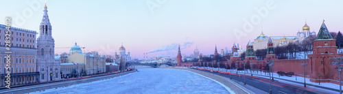 Panoramic view of the Moskva river with the Christ the Savoir's Cathedral, Kremlin's tower and a factory releasing smoke in the background in Moscow, Russia photo