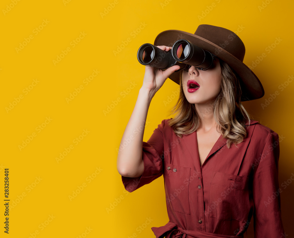 Woman in 1940s style clothes with binoculars Woman in 1940s style clothes with binoculars