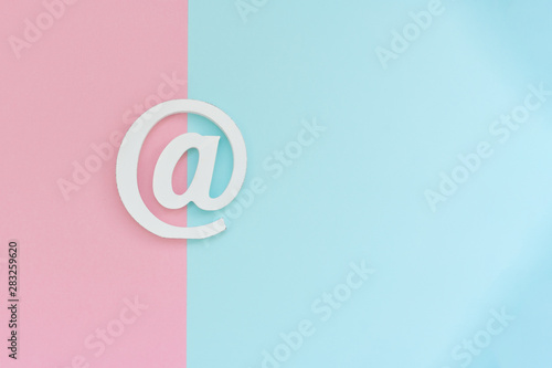 Email symbol on blue and pink background. Concept for email  communication or contact us