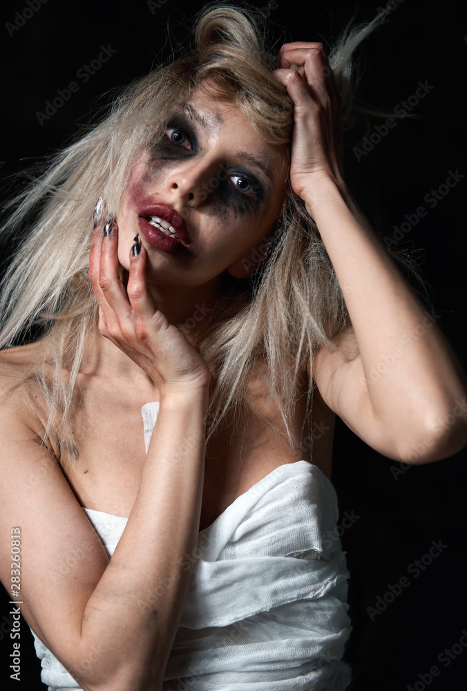 Foto Stock Weird mad girl. Morbid sad young woman (freak) with messy  make-up. Portrait of madman (mental sick) | Adobe Stock