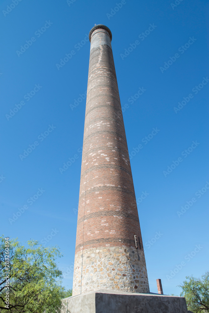 Old brick chimney called LA RAMONA located in the historic old mining town of  EL TRIUNFO, near La Paz Baja California Sur. MEXICO