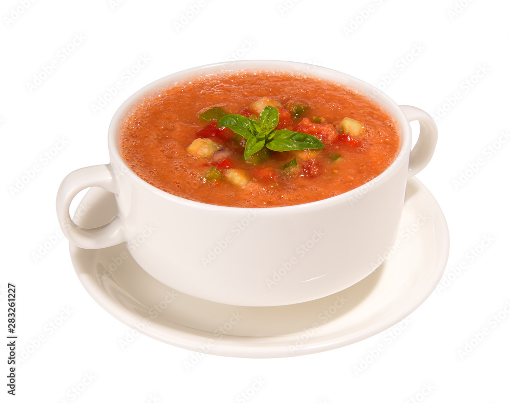 Traditional Spanish cold gazpacho soup in broth cups and saucer isolated on white background Traditional Spanish cold gazpacho soup in broth cups and saucer isolated on white background