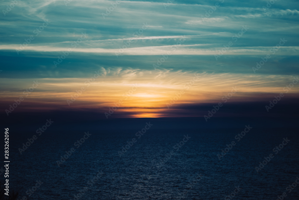 Photo of the ocean during the sunset