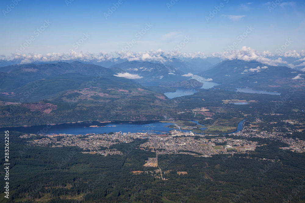 Aerial view of a small town, Port Alberni, on Vancouver Island during a sunny summer morning. Located in British Columbia, Canada.