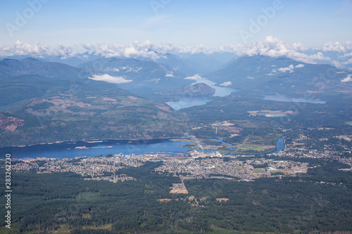 Aerial view of a small town, Port Alberni, on Vancouver Island during a sunny summer morning. Located in British Columbia, Canada.