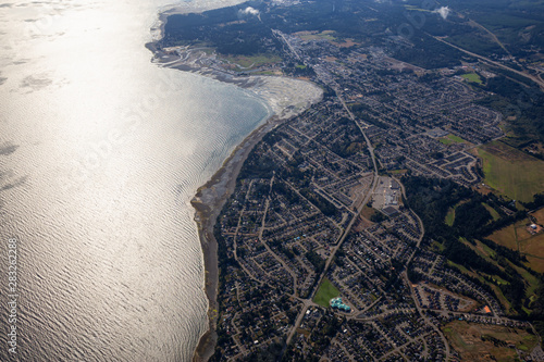Aerial view of a small town, Parksville, on Vancouver Island during a sunny summer morning. Taken near Nanaimo, British Columbia, Canada. photo