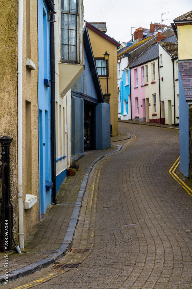 Street with coloured houses, in the United Kingdom.